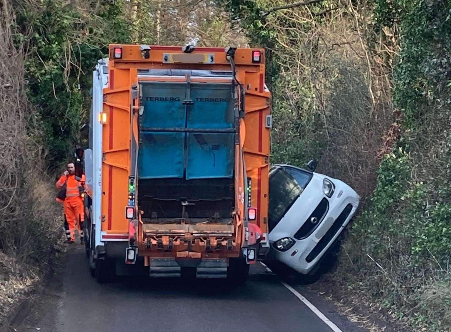 A car got stuck between a bin lorry in Ruins Barn Road, Sittingbourne. Picture: Kelly Henden