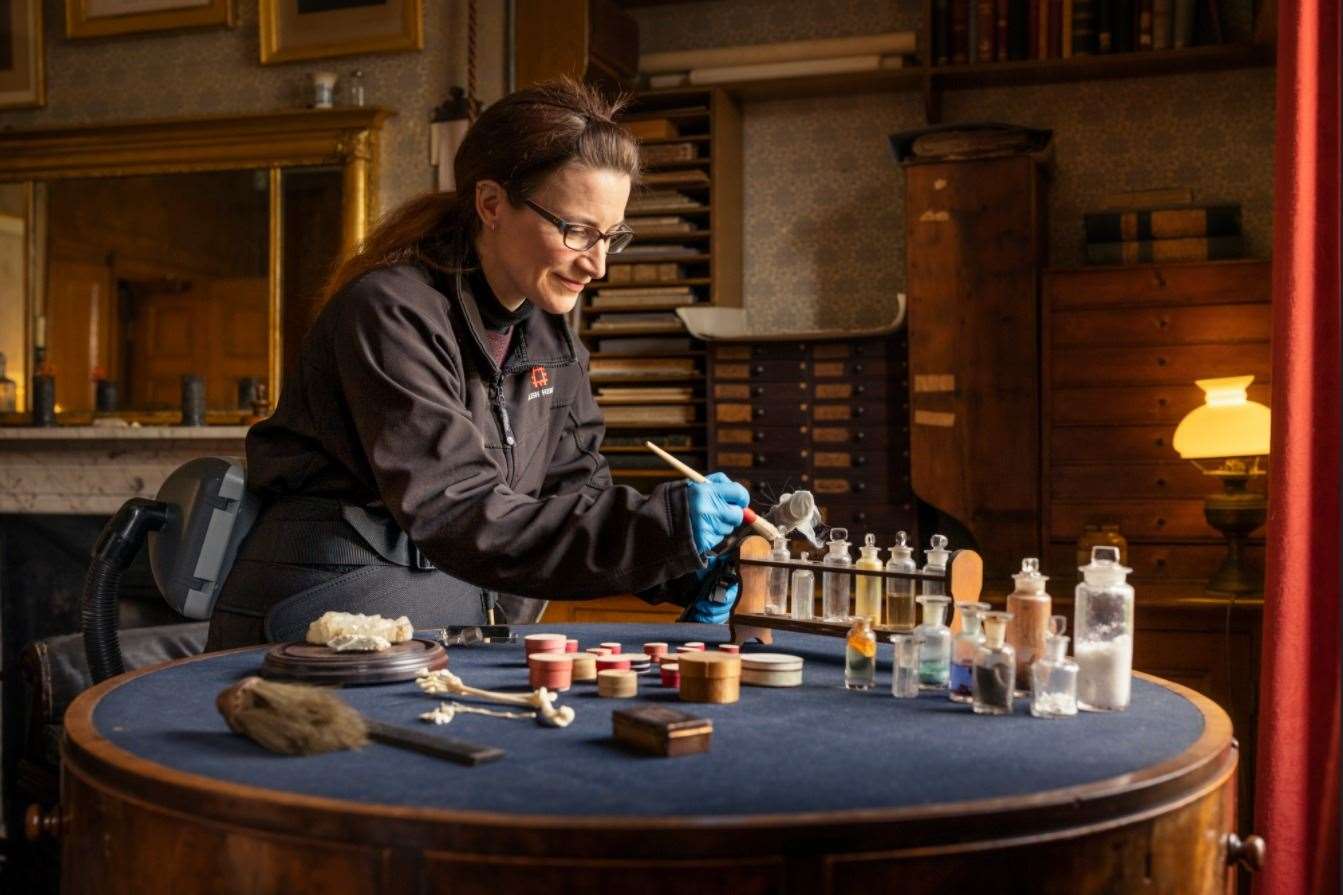 Cleaning of artefacts at Down House Picture: English Heritage