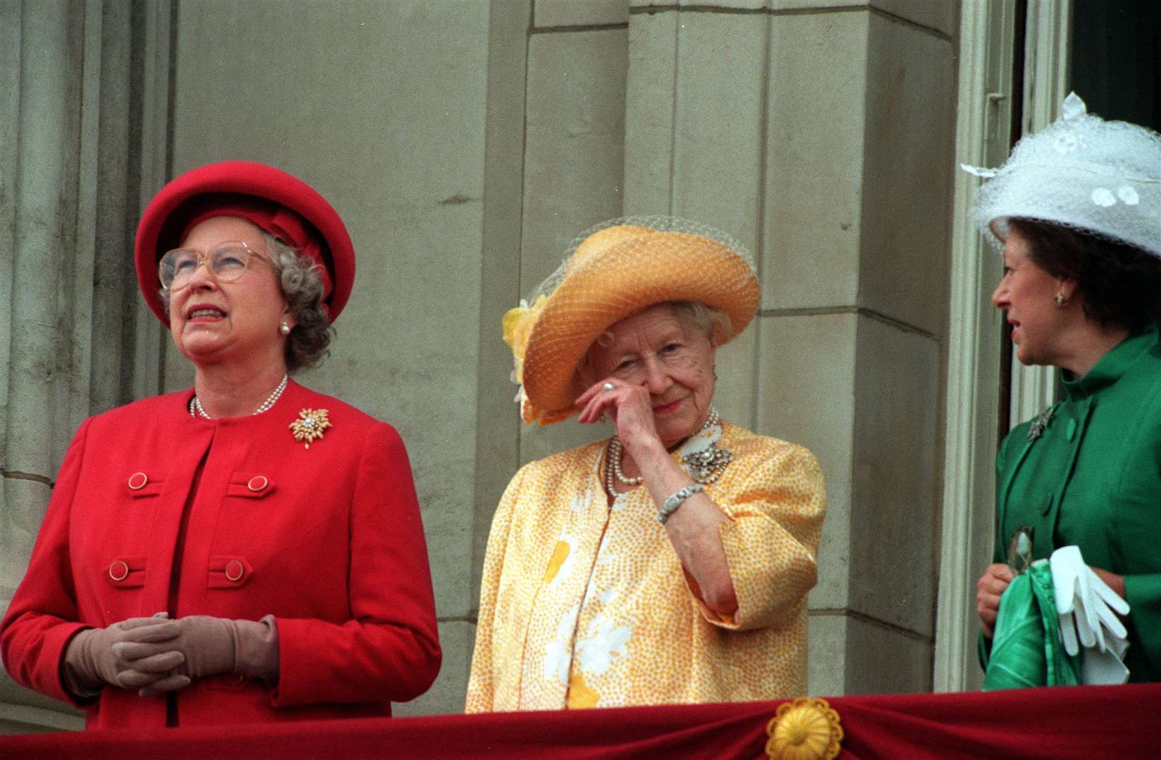 The Queen, alongside the Queen Mother and Princess Margaret on the balcony of Buckingham Palace for the 50th anniversary of VE Day in 1995 (PA)