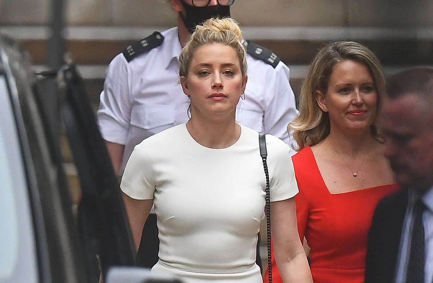 Actress Amber Heard leaves the High Court (Victoria Jones/PA)