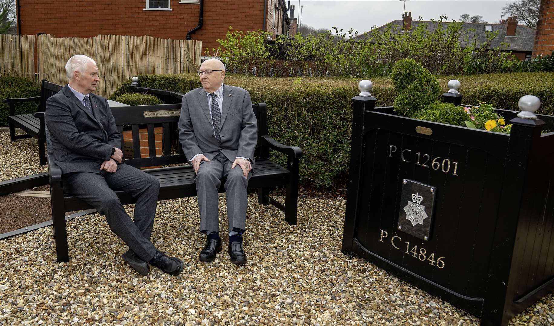 Bryn Hughes and Paul Bone, the fathers of murdered Pcs Nicola Hughes and Fiona Bone, at the Hyde police station memorial garden, in Manchester (Peter Byrne/PA)