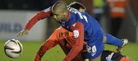 Deon Burton is fouled by Exeter keeper Artur Krysiak