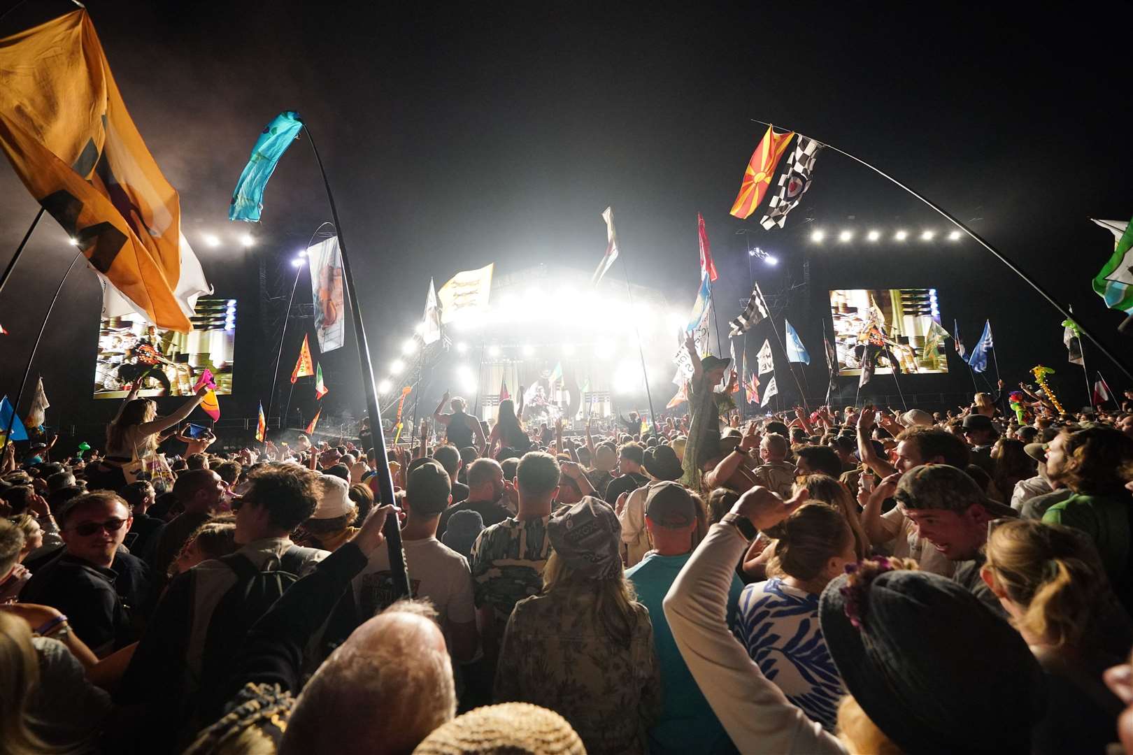 Crowds watch the Arctic Monkeys performing at the Glastonbury Festival at Worthy Farm in Somerset. Picture date: Friday June 23, 2023.