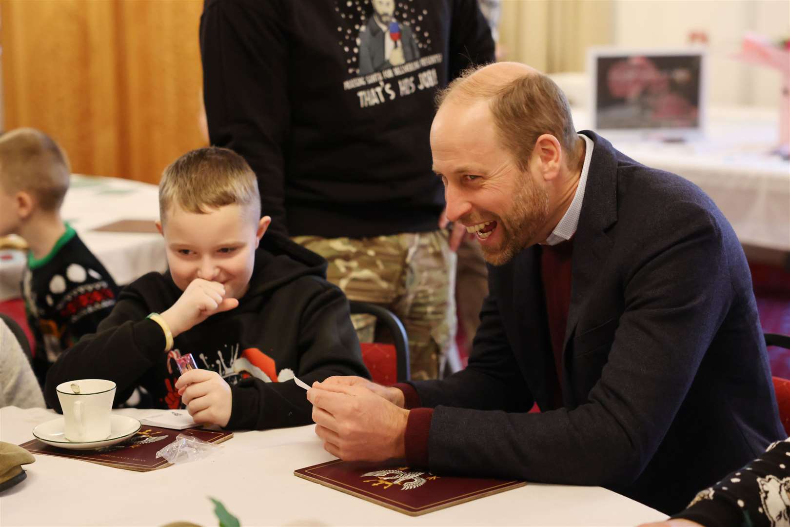 William reacts as he is looks at a picture of himself by 10-year-old Karson Heighway (Richard Pohle/The Times/PA)