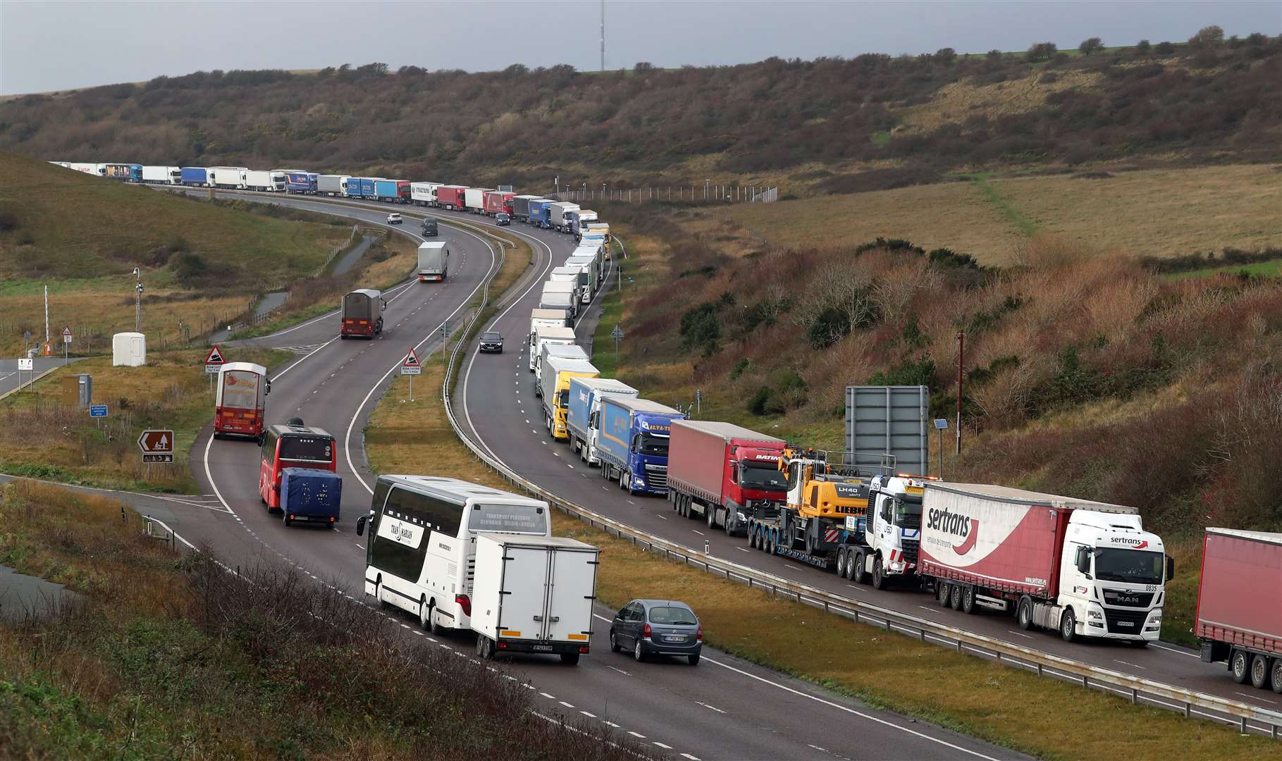 Lorries queue on the A20 to enter the port of Dover (Gareth Fuller/PA)