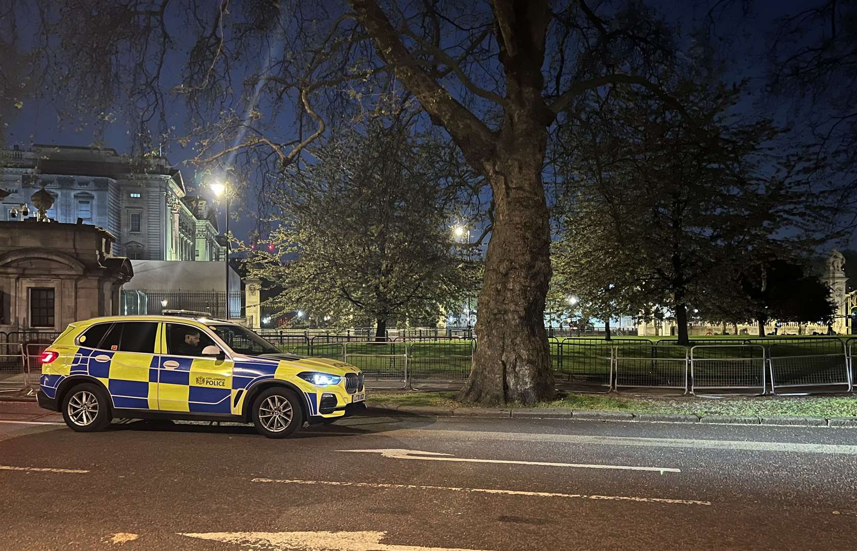 A police car outside Buckingham Palace, London, where a man has been arrested after throwing suspected shotgun cartridges into the palace grounds. Picture date: Tuesday May 2, 2023.