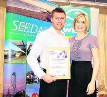 Chris Smith receives his Individual Learner Award from Sky News presenter Charlotte Hawkins