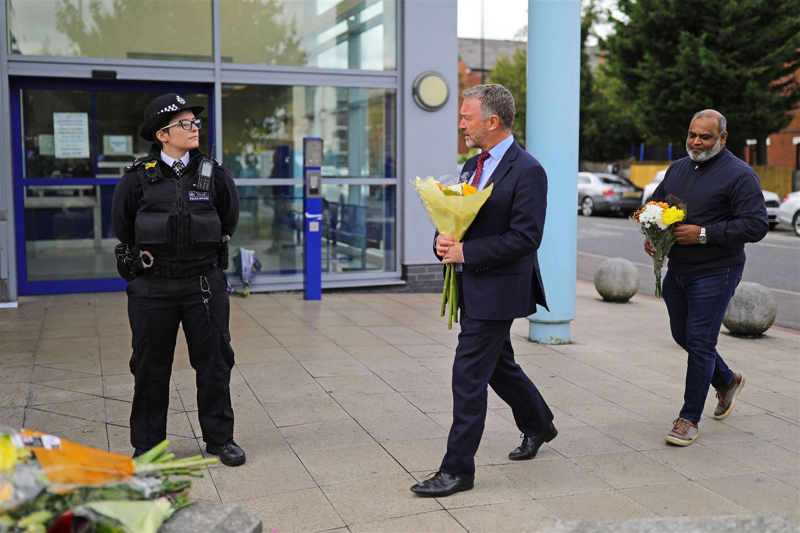 Steve Reed, Labour MP for Croydon North, leaves flowers outside Croydon Custody Centre (Aaron Chown/PA)