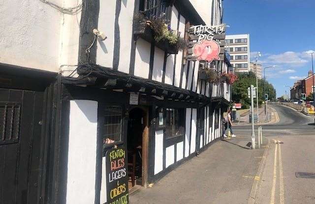 Ye Olde Thirsty Pig is on Knightrider Street and you can hear the car radios from the traffic through the open door