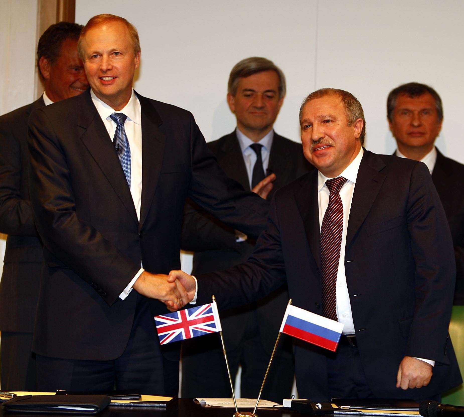 Former BP boss Bob Dudley, left, signed a deal with Rosneft in 2011 – current Rosneft boss and Putin ally Igor Sechin, far right, looks on (Sean Dempsey/PA)