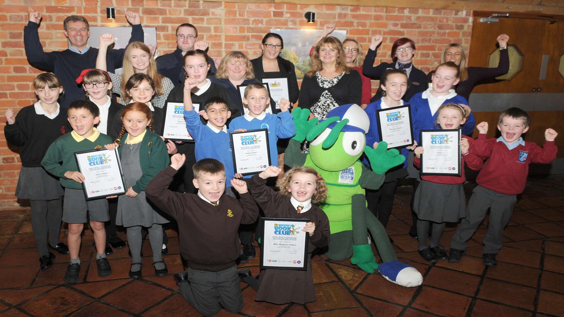 Winners of the Buster's Book Club reading challenge at Leeds Castle with supporters from KCC, Medway Council, Three R’s, Ashford BC, Golding Vision, Specsavers and Bel UK.