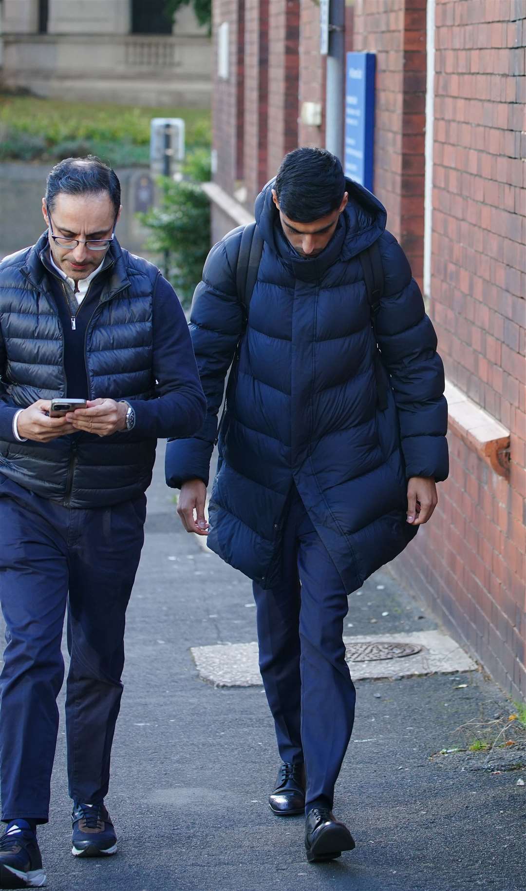 Adam Chowdhary, right, outside Stockport Coroner’s Court on Tuesday (Peter Byrne/PA)