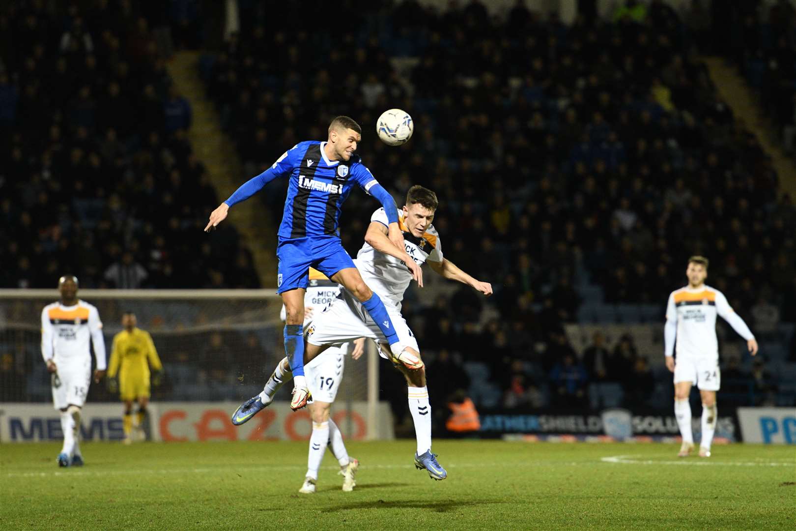 Captain Stuart O'Keefe gets up for the ball as Gillingham beat Cambridge United on Tuesday Picture: Barry Goodwin