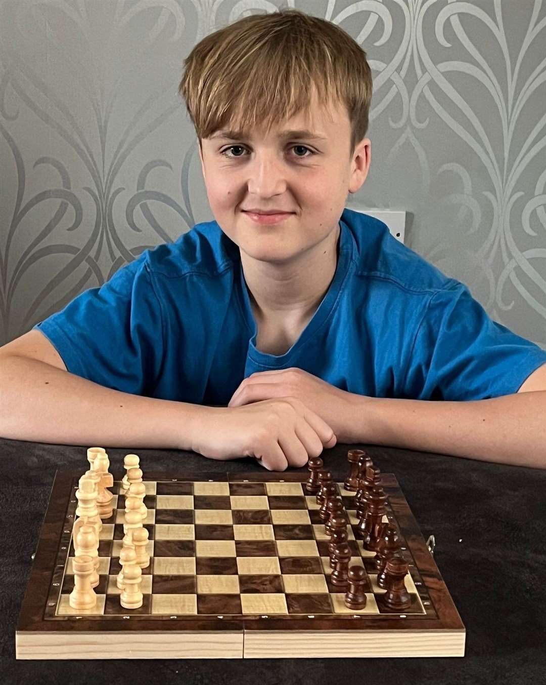 Young patient Calum Griffin played chess to calm his nerves during foot surgery. Photo: SWNS