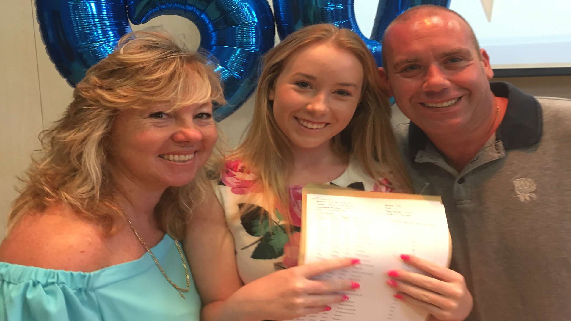 Kayla Samson with parents Michelle and Bradley.