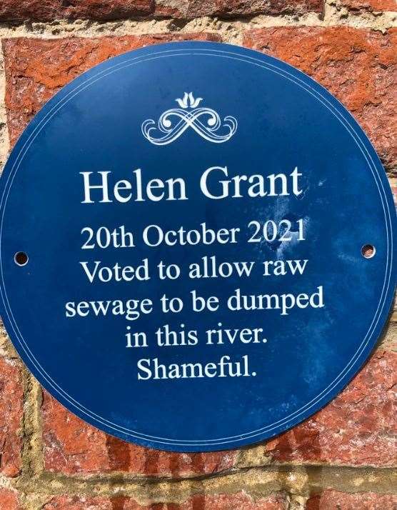 A blue plaque has appeared in Maidstone accusing the town’s MP Helen Grant of ‘voting to allow raw sewage to be dumped into a river’.