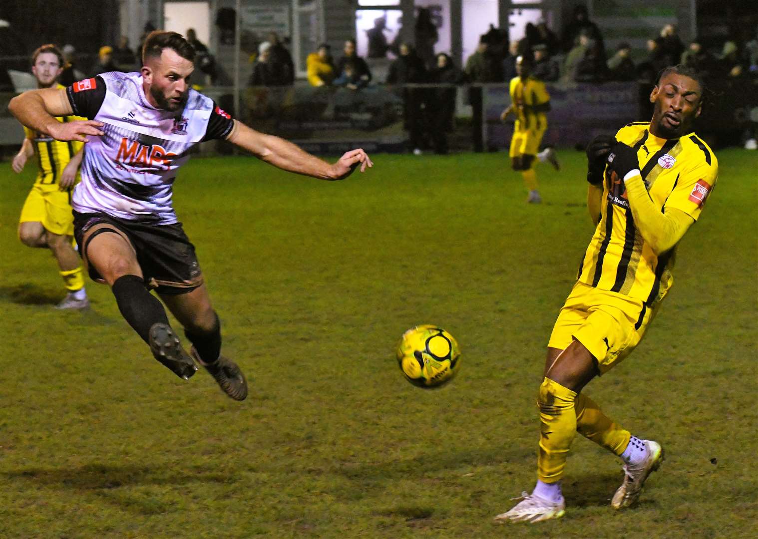 Deal defender Josh Vincent clears against Sheppey scorer Gil Carvalho. Picture: Marc Richards