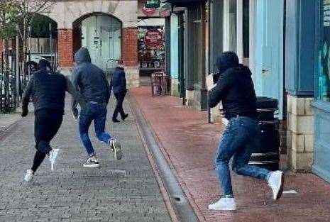 One witness pictured the gang running away from the Sevenoaks store. Picture: Kent Police