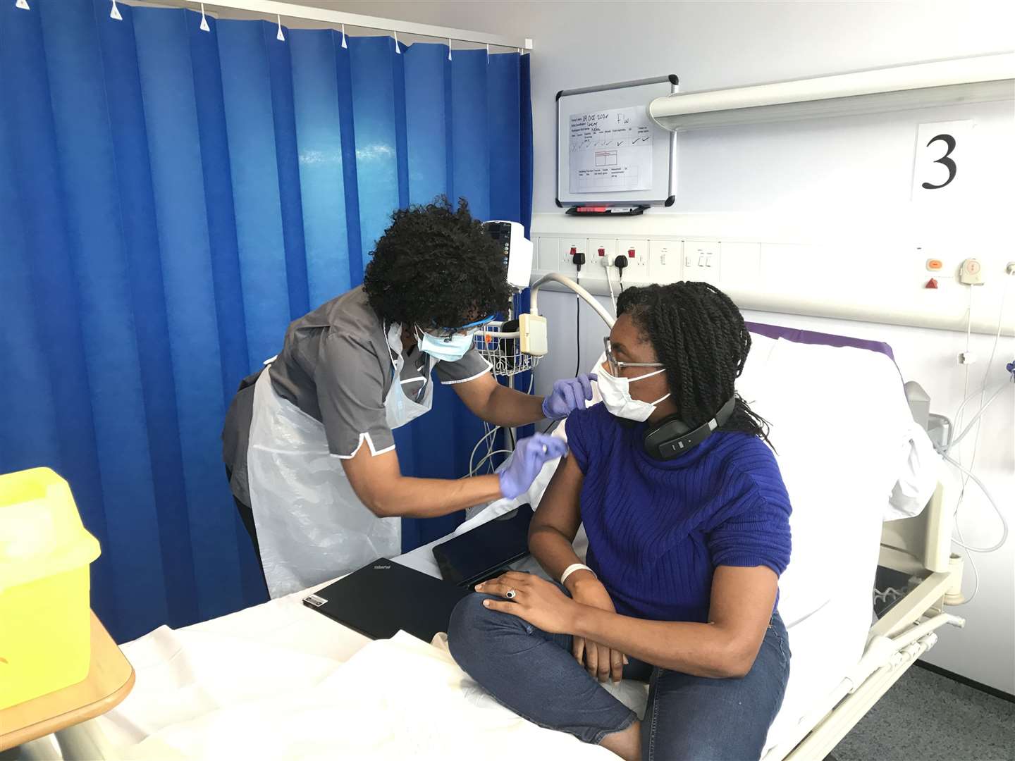 Conservative minister Kemi Badenoch receiving her first vaccination as part of the Novavax phase 3 trial (PA)