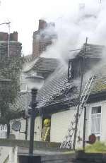 TERRACE FIRE: More than 60 firefighters tackled the blaze. Picture by Barry Crayford