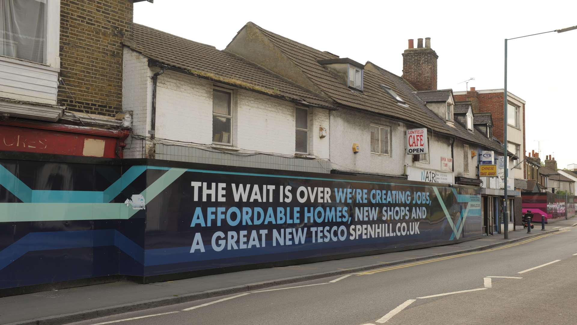 Tesco's message on the hoardings before they pulled out of Lowfield Street