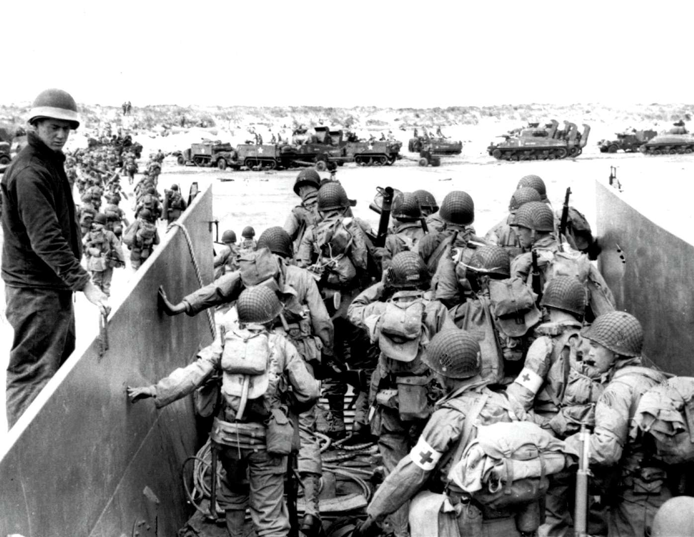 US Army soldiers disembark from a landing craft during the Normandy landings. Picture: PA Photos/DPA
