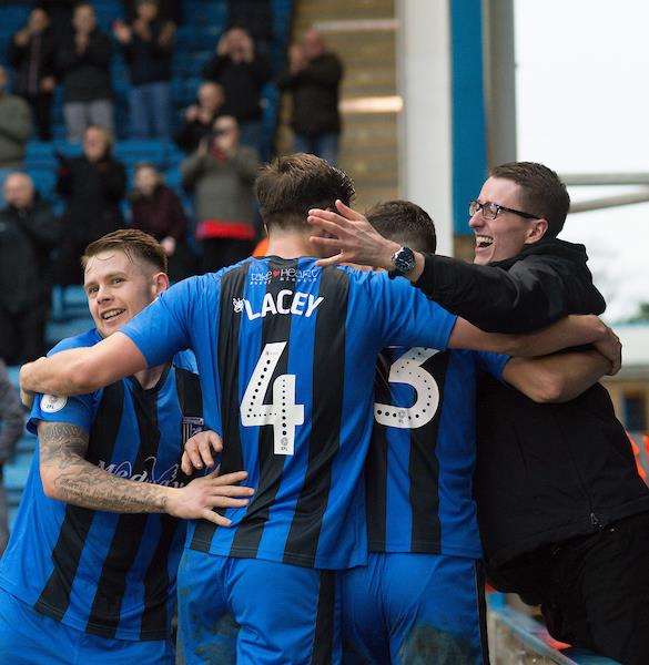 Alex Lacey, celebrating Gills' second goal against Portsmouth, impressed at the back Picture: Ady Kerry (6207991)