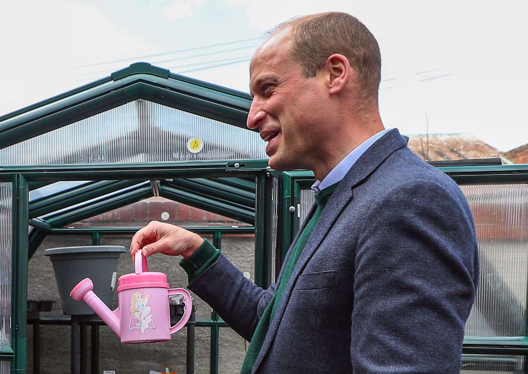 William joked about the colour of the watering can (Peter Byrne/PA)