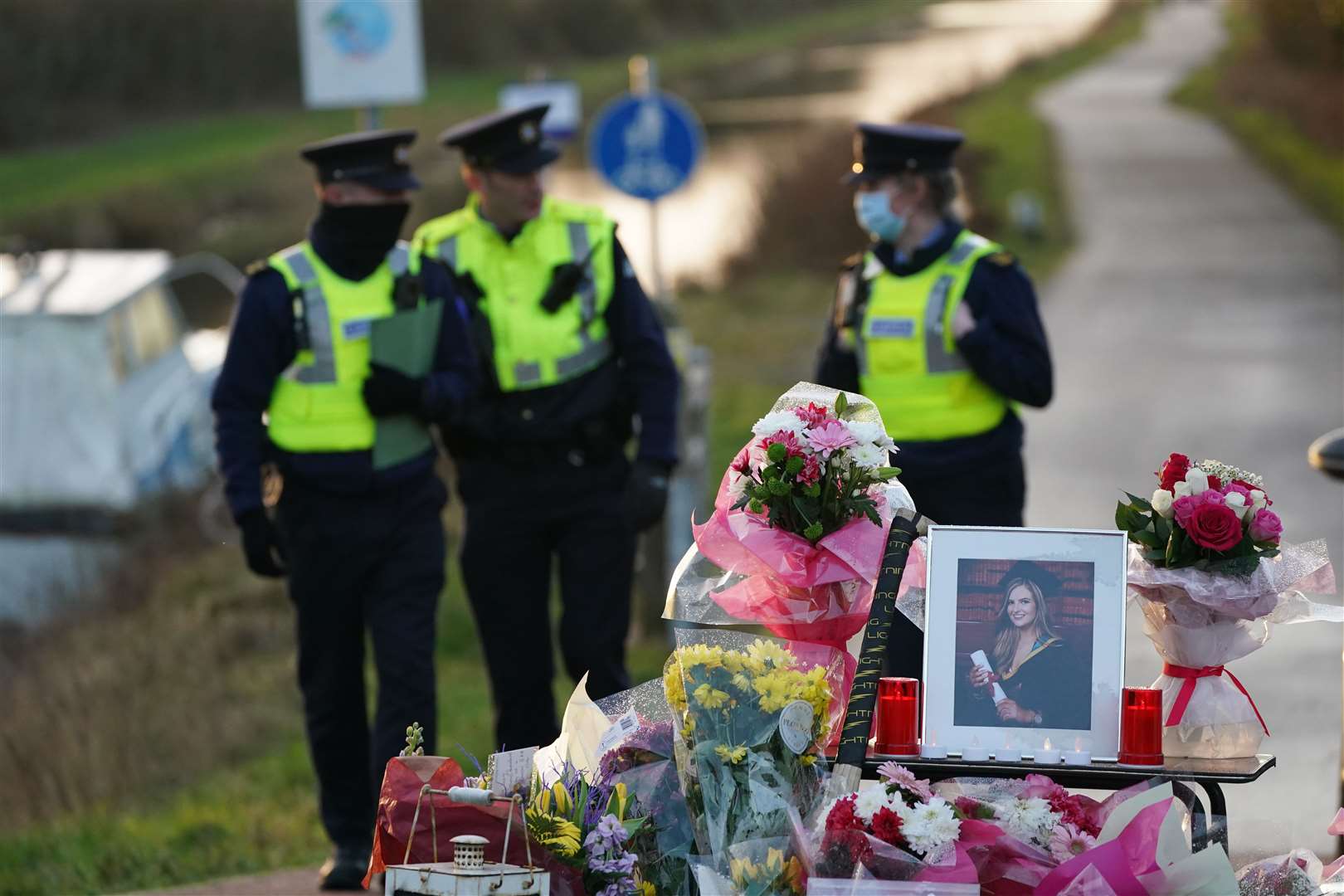 Floral tributes to Ashling Murphy laid at the Grand Canal in Tullamore (Brian Lawless/PA)