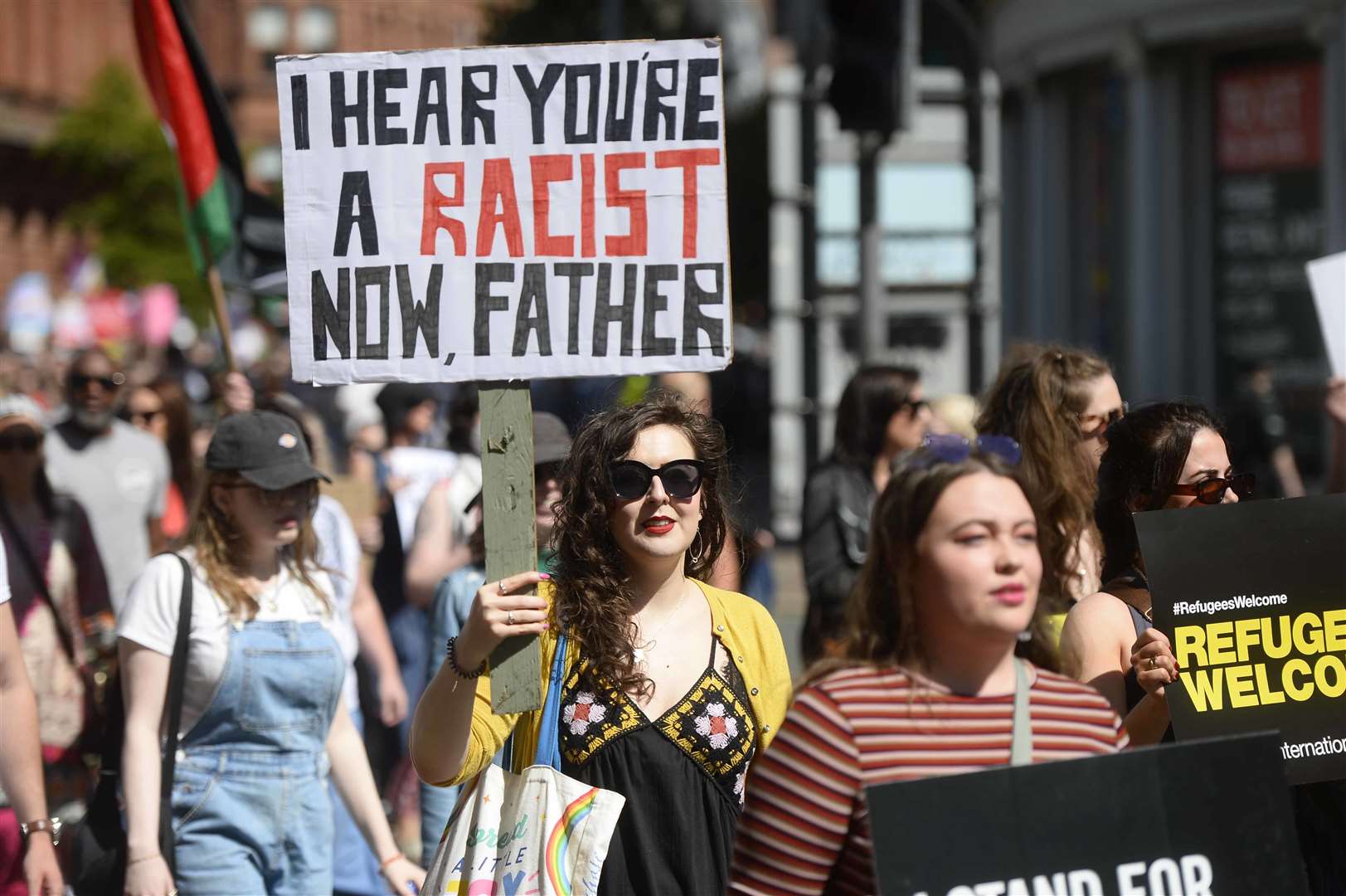 Demonstrators take part in a United Against Racism rally in Belfast (PA)