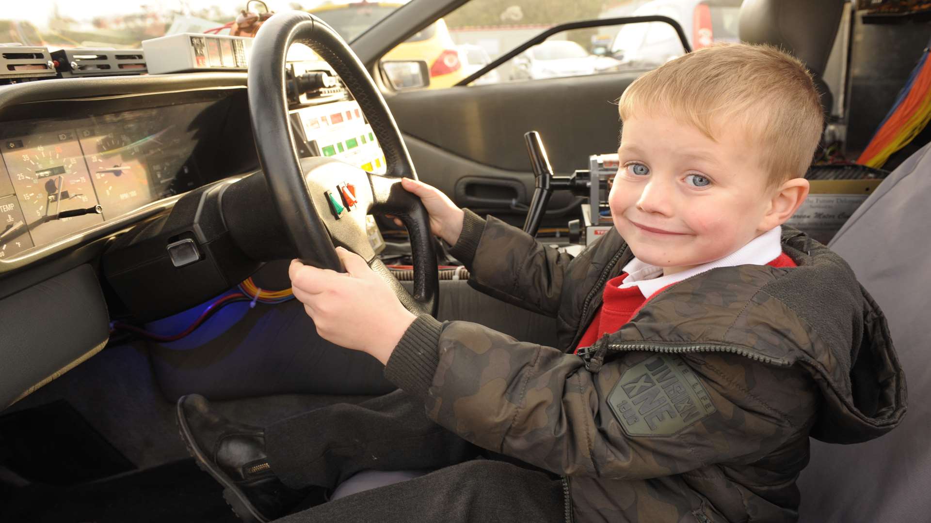 Tommy at the wheel of the car