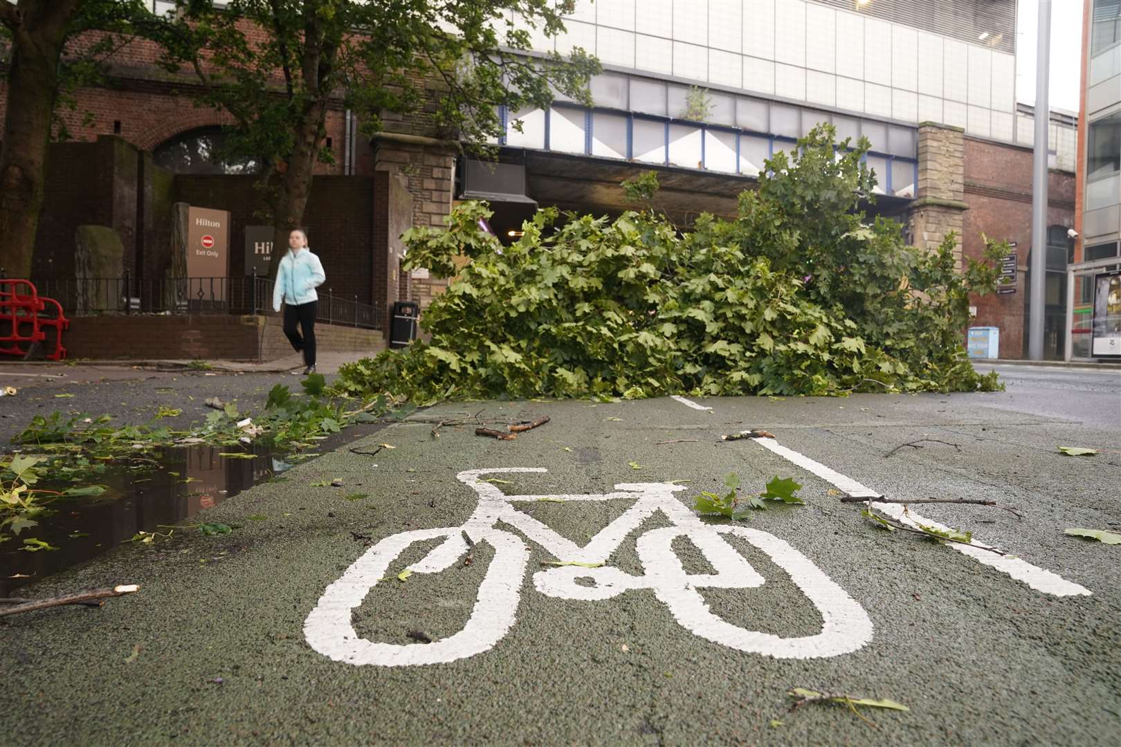 A tree branch blocks a cycle path in Leeds city centre as Storm Lilian hit the UK on Friday (Danny Lawson/PA)