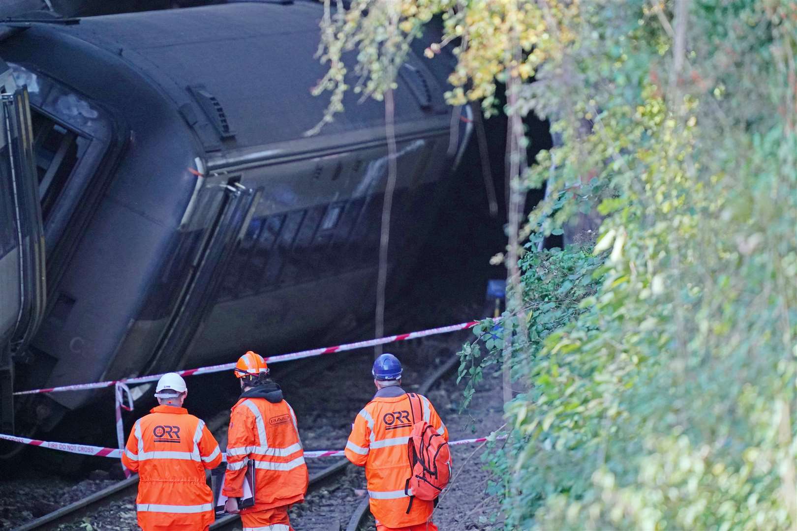 Officials from the Office of Road and Rail and Rail Accident Investigation Branch at the scene (Steve Parsons/PA)