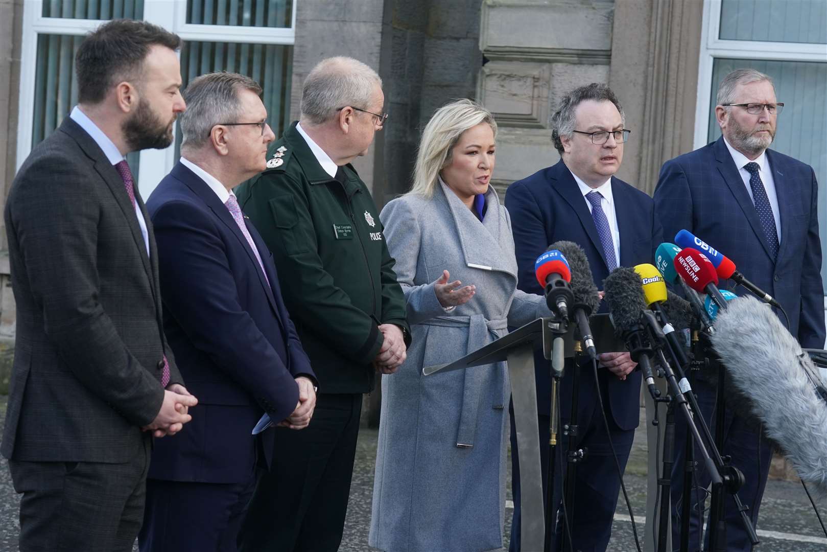 (left to right) SDLP leader Colum Eastwood, DUP leader Jeffrey Donaldson, Chief Constable Simon Byrne, Sinn Fein deputy leader Michelle O’Neill, Stephen Farry from the Alliance party, and Ulster Unionist Party leader Doug Beattie, speaking to the media outside the PSNI HQ in Belfast (Brian Lawless/PA)