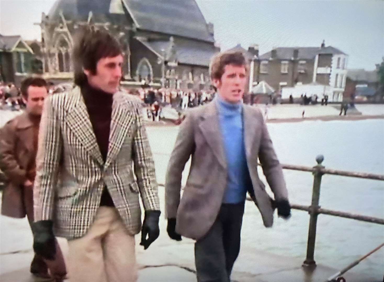Ray Featherstone, left, became Michael Crawford's 'bodyguard' for the day during filming of the 1975 Christmas special of Some Mothers Do 'Ave 'Em of Neptune Jetty in Sheerness, Sheppey. Picture: BBC as featured in Channel 5 TV documentary