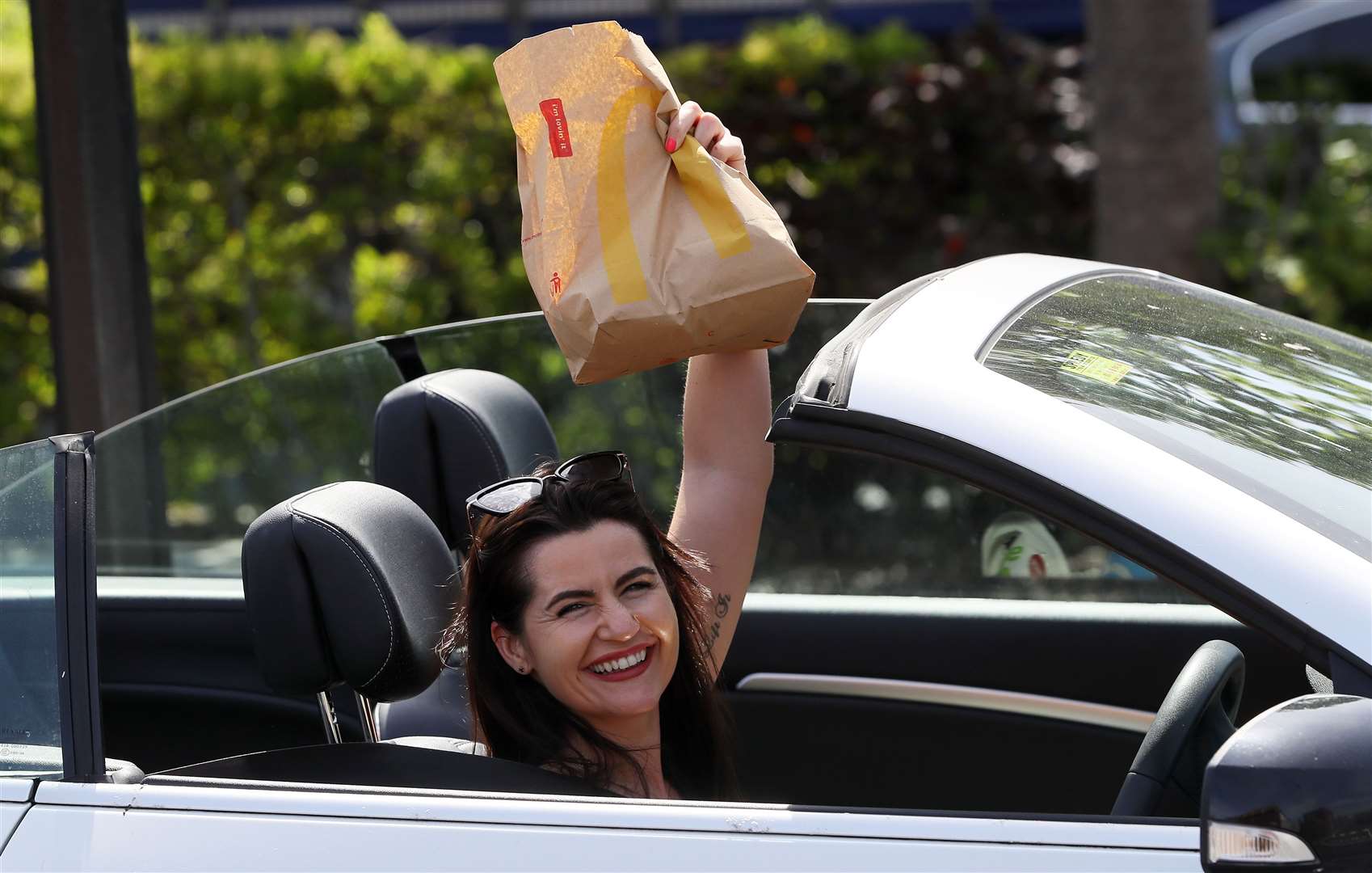 Theresa Hyland leaving the McDonald’s drive-thru with an order (Brian Lawless/PA)