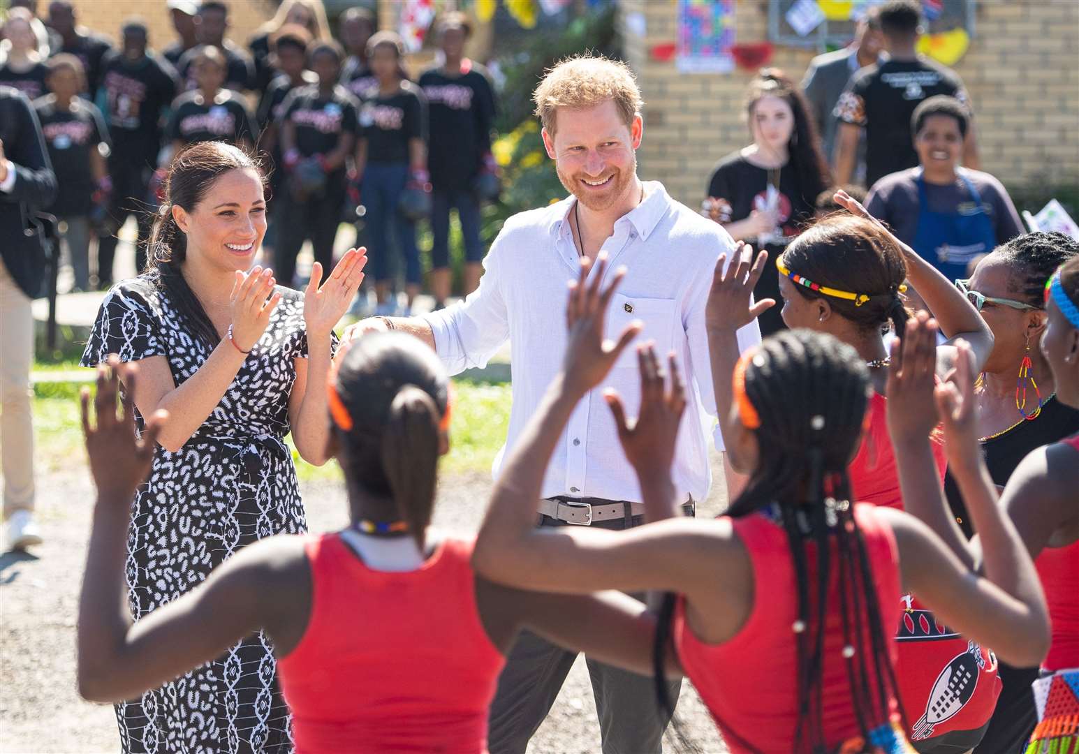 Meghan, pictured with Harry in the Nyanga Township in Cape Town, launched her legal action while in South Africa (Dominic Lipinski/PA)