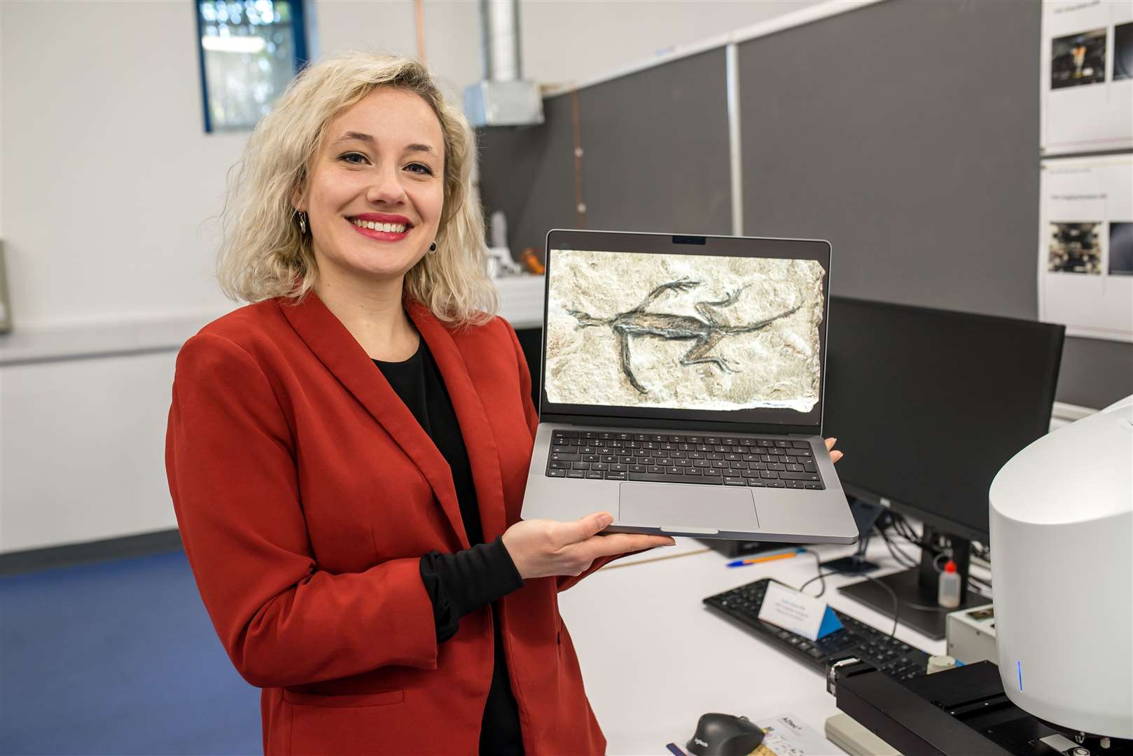 Dr Valentina Rossi with an image of Tridentinosaurus antiquus (Zixiao Yang/University College Cork)