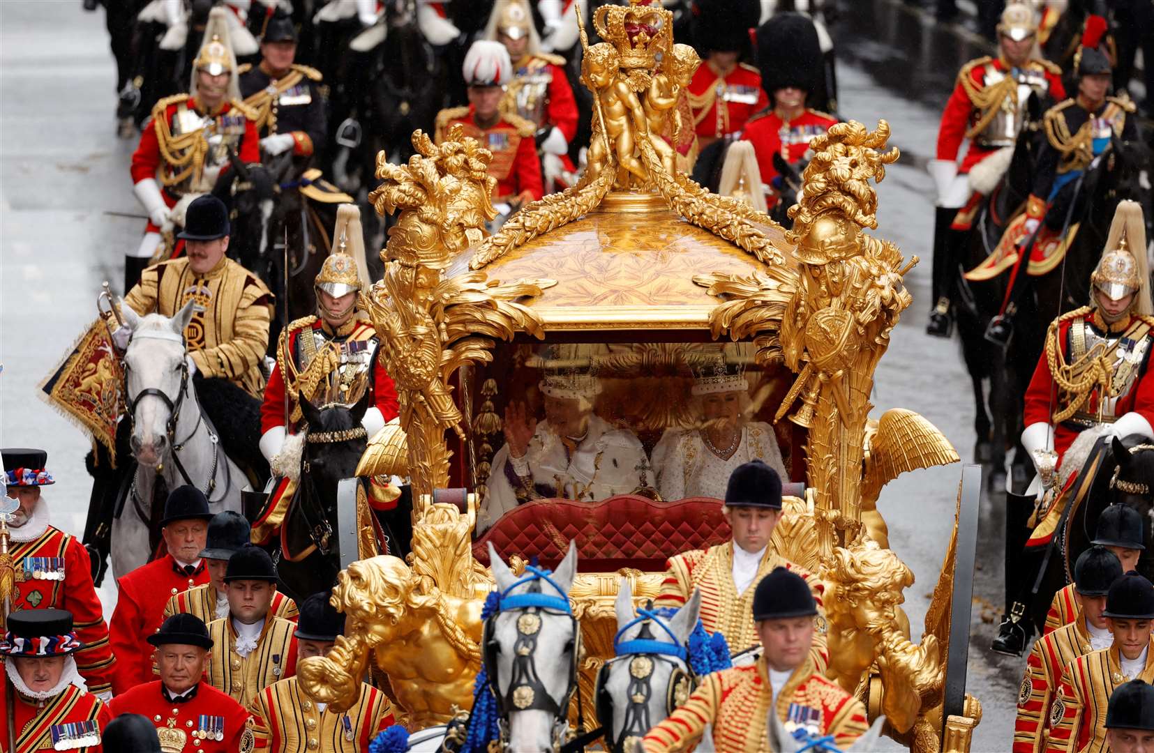 Charles and Camilla on their way back to Buckingham Palace after the coronation (Piroschka van de Wouw/PA)