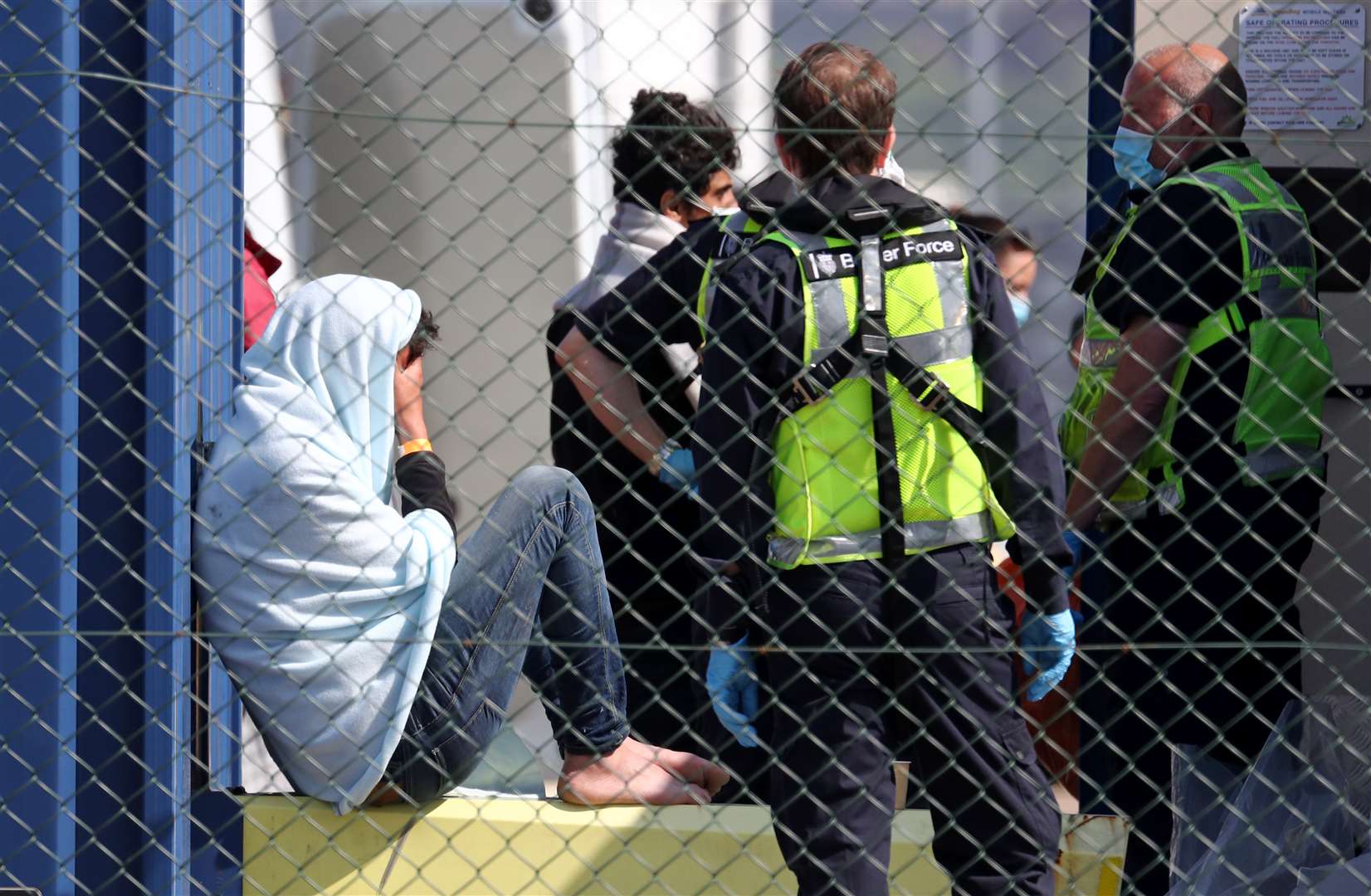 A man thought to be a migrant is processed by Border Force officers in Dover, Kent, following small boat incidents in the English Channel on Saturday (Gareth Fuller/PA)