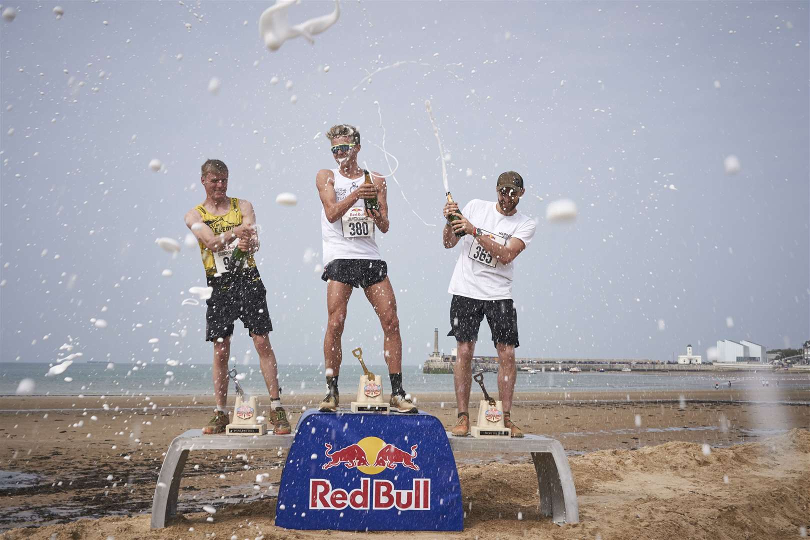 Lloyd Kempson sprays the champagne on the podium at the 2019 Red Bull Quicksand. Picture: Red Bull Media House
