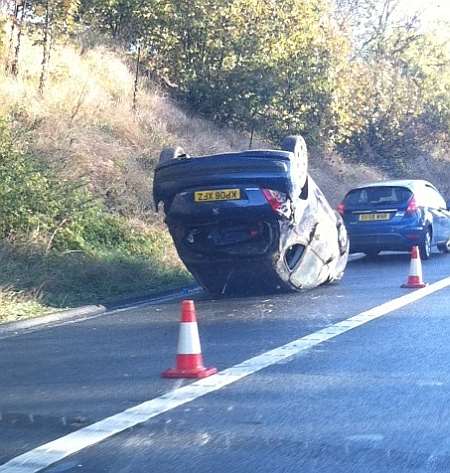 Car flipped onto its roof on the M2