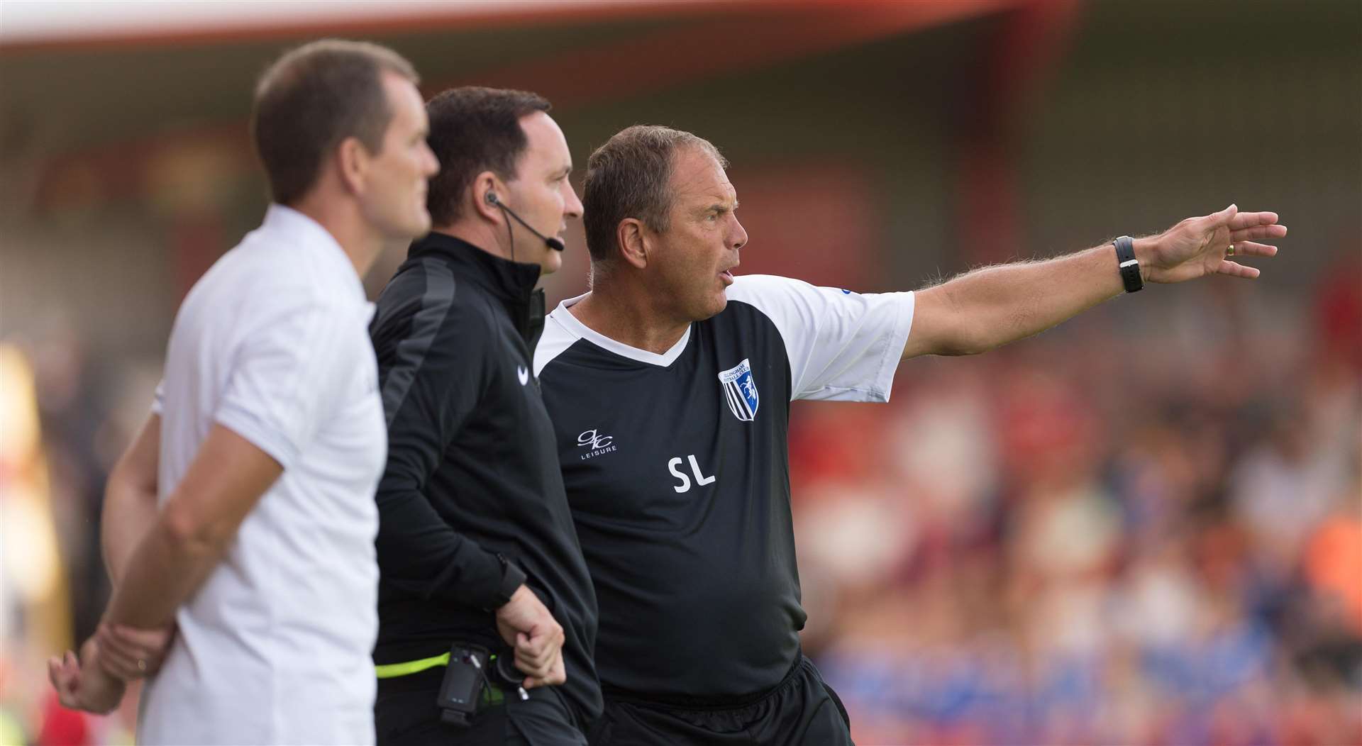 Gillingham manager talking to the fourth official Joe Johnson at Accrington Picture: Ady Kerry