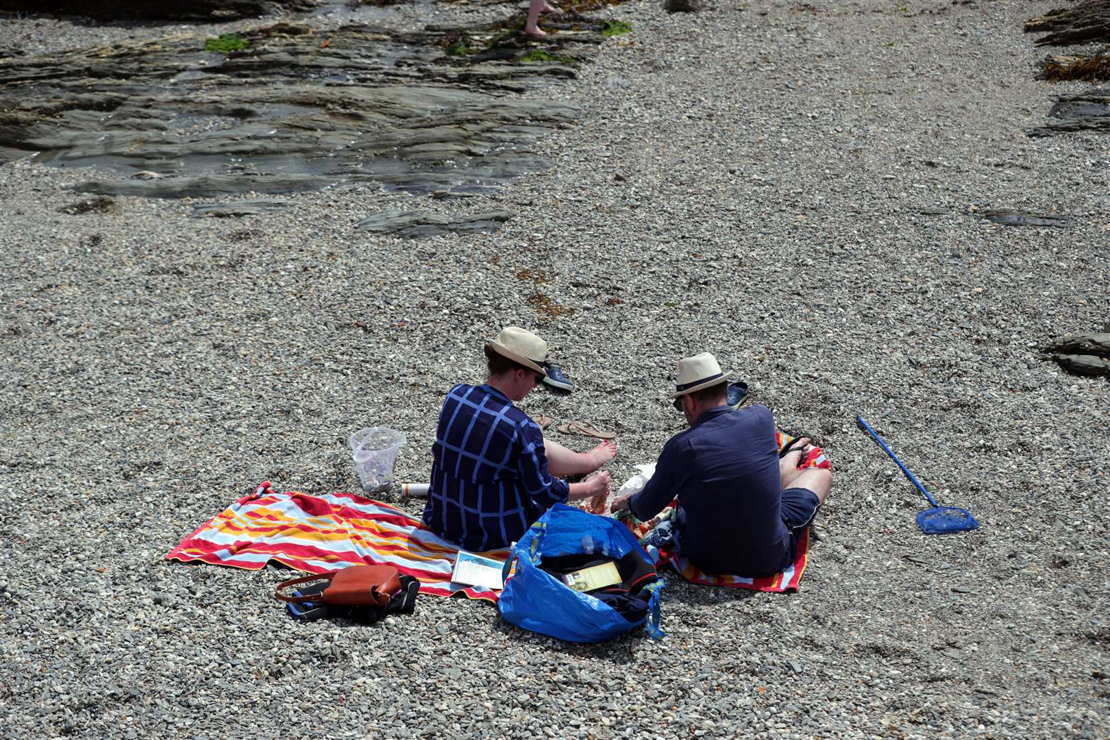 People on the beach at St Mawes, Cornwall, where the coronavirus case rate is the lowest in the country after the Isle of Wight (David Davies/PA)