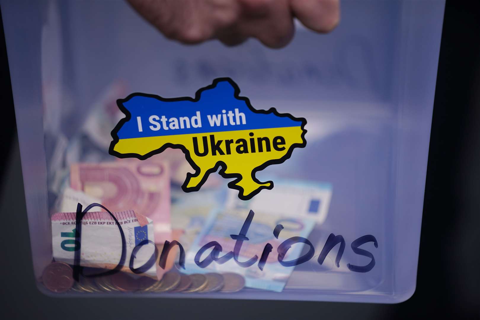 People collect financial donations during a protest against the Russian war in Ukraine in Dublin city centre (Niall Carson/PA)