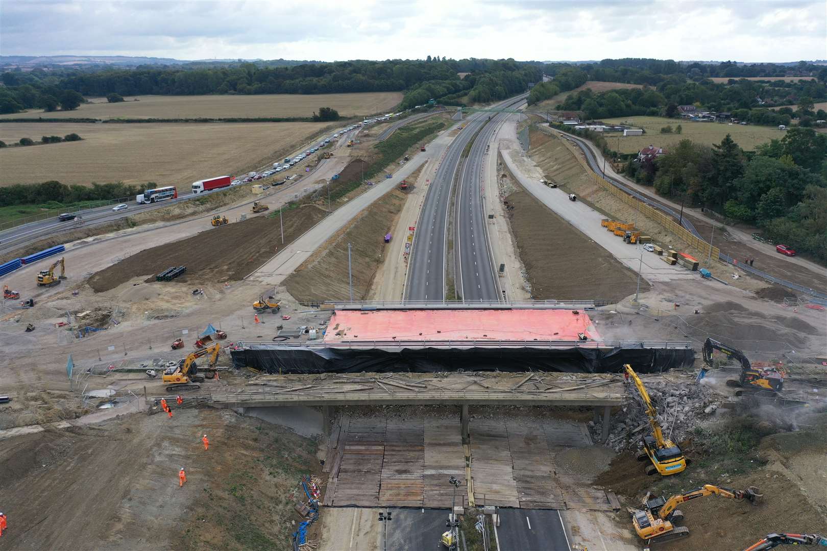 Contractors at work as queues build on the A20. Picture: Martin Newman