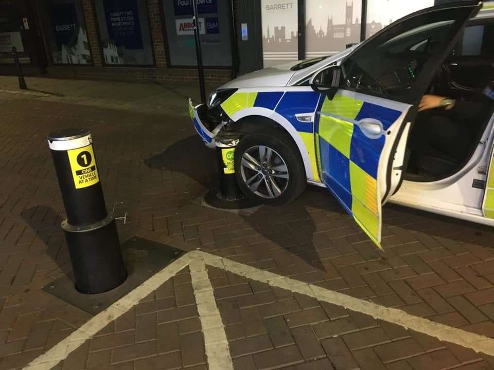 A police car stuck on an anti-terror bollard in St Peter's Street, Canterbury. Picture: Howard Sanders