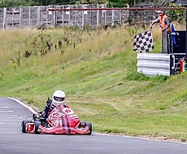 Dan Tidwell takes the chequered flag at Tattershall Kart Centre in Lincolnshire Picture: Nigel Cordrey