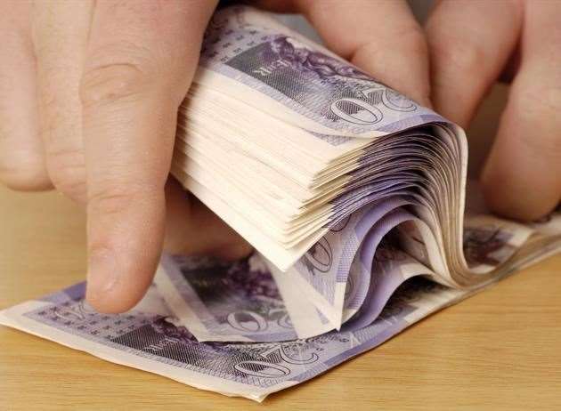 A man has had to forfeit almost £15,000 after police found large sums of cash stashed at his address. Stock Image
