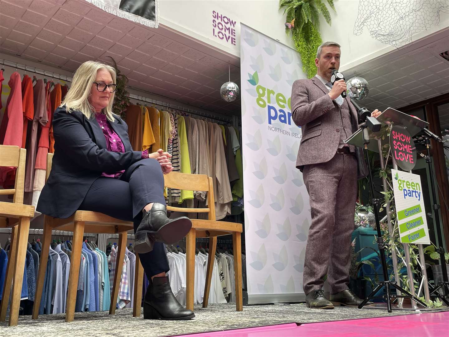 Party leader Mal O’Hara (right) and deputy leader Lesley Veronica (seated left) during the manifesto launch at the Show Some Love Greenhouse centre in Belfast (Rebecca Black/PA)